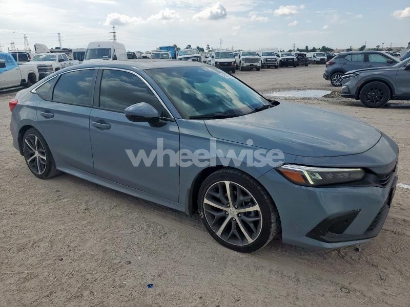 Photo 3 of 2022 HONDA CIVIC TOURING (VIN 2HGFE1F98NH327127)