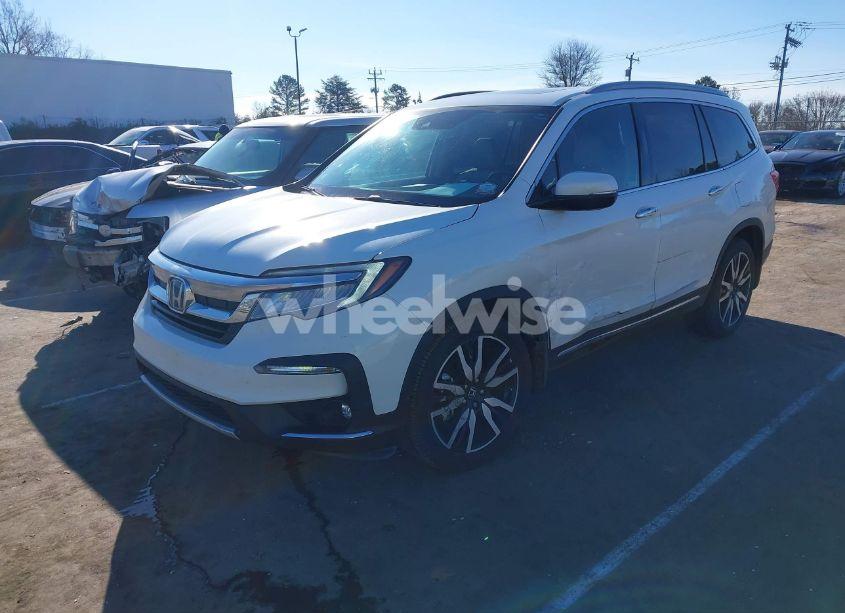 Photo 2 of 2021 Honda Pilot 2WD TOURING 7 PASSENGER (VIN 5FNYF5H64MB031671)