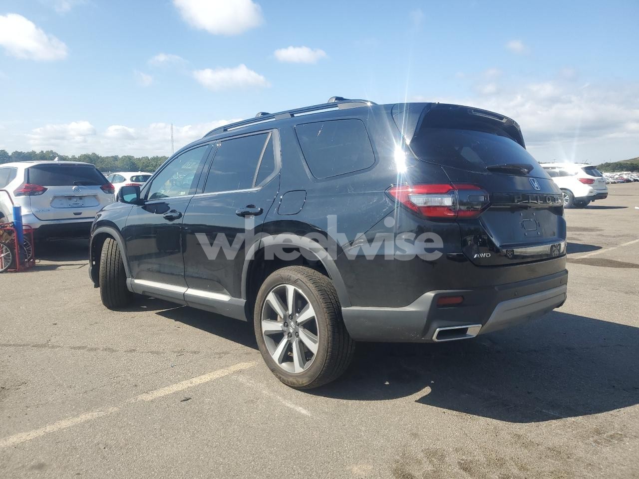 Photo 2 of 2023 HONDA PILOT TOURING (VIN 5FNYG1H78PB051750)