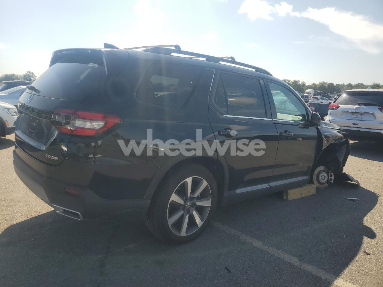 Photo 3 of 2023 HONDA PILOT TOURING (VIN 5FNYG1H78PB051750)