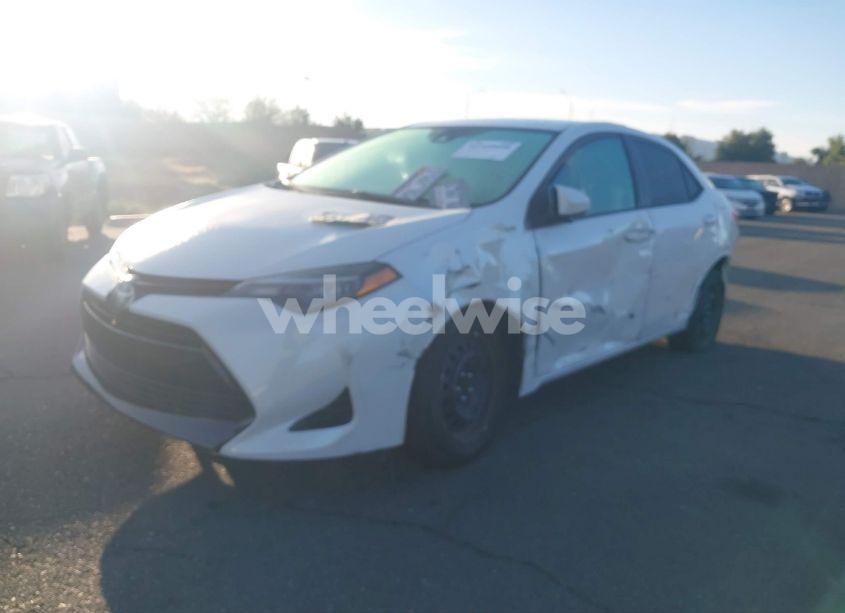Photo 2 of 2017 Toyota Corolla LE (VIN 5YFBURHE1HP692823)