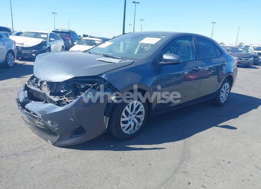 Photo 2 of 2017 Toyota Corolla LE (VIN 5YFBURHE2HP718510)