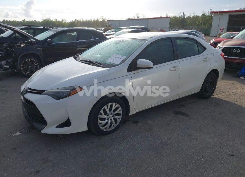 Photo 2 of 2017 Toyota Corolla LE (VIN 5YFBURHE3HP709833)