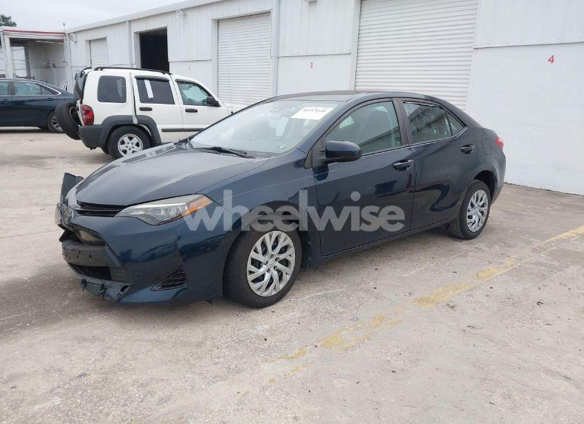 Photo 2 of 2017 Toyota Corolla LE (VIN 5YFBURHE4HP681492)