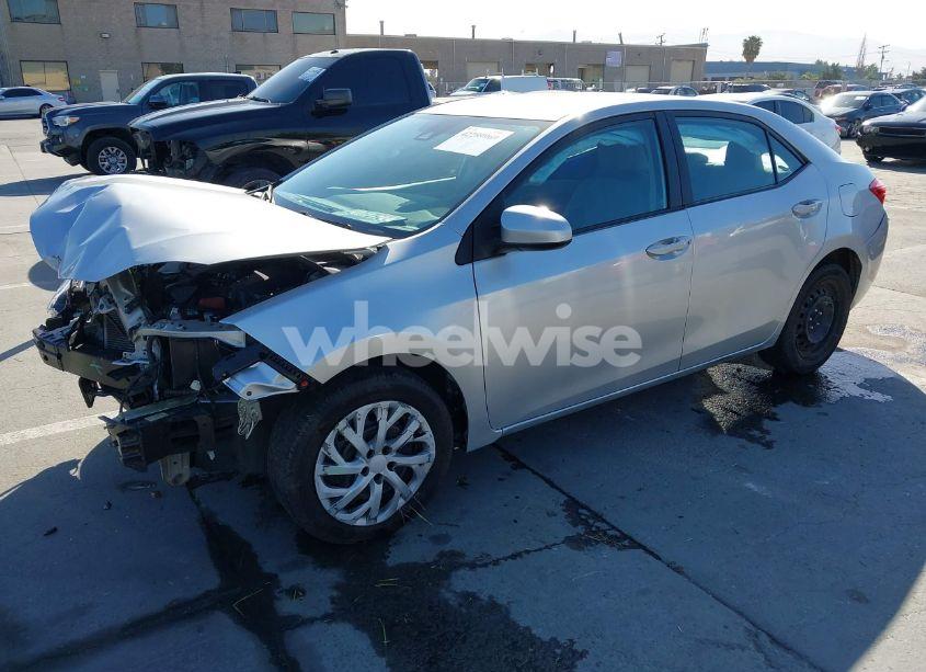 Photo 2 of 2017 Toyota Corolla LE (VIN 5YFBURHE5HP569817)
