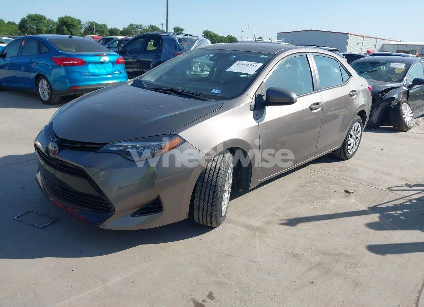 Photo 2 of 2017 Toyota Corolla LE (VIN 5YFBURHE6HP670722)
