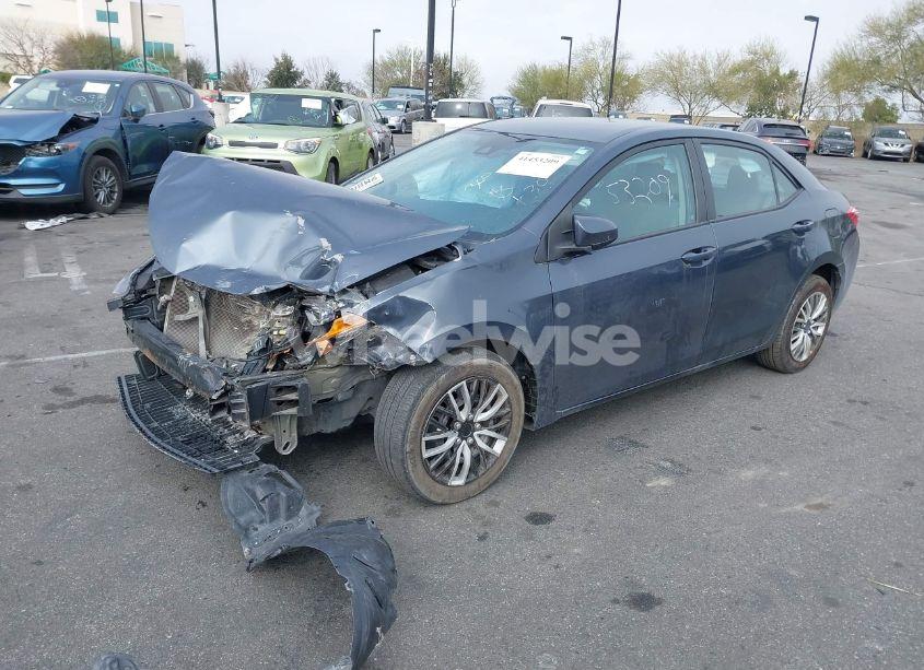 Photo 2 of 2017 Toyota Corolla LE (VIN 5YFBURHE9HP686686)