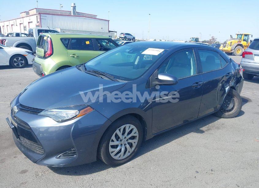 Photo 2 of 2017 Toyota Corolla LE (VIN 5YFBURHEXHP571448)