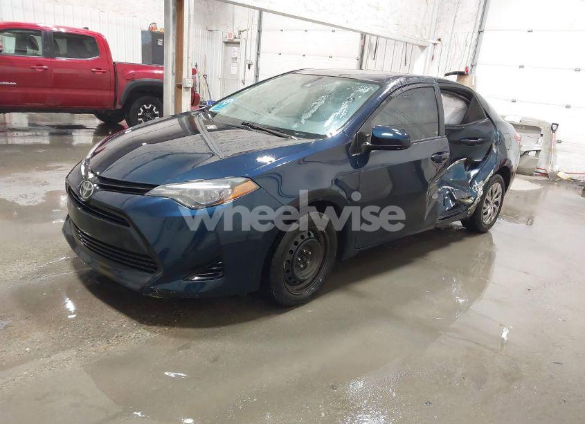 Photo 2 of 2017 Toyota Corolla LE (VIN 5YFBURHEXHP678029)