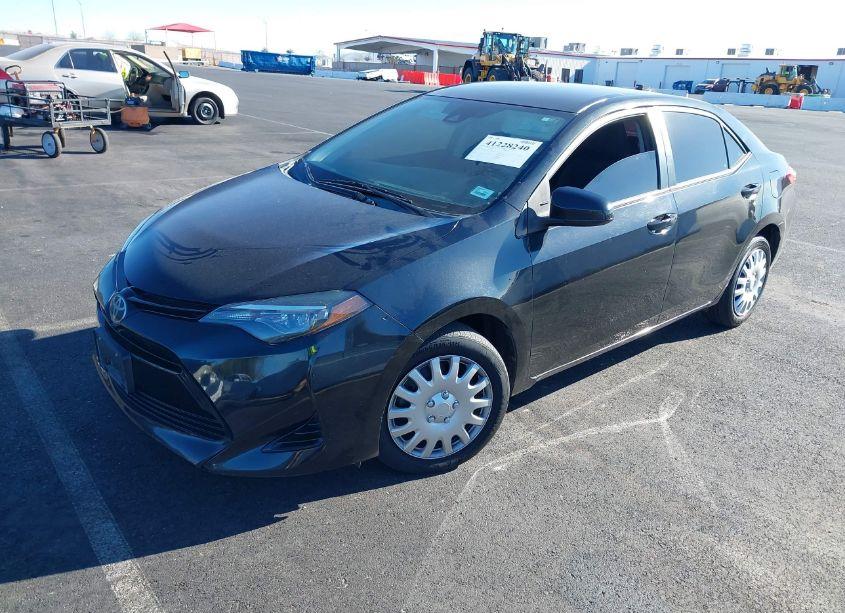 Photo 2 of 2017 Toyota Corolla LE (VIN 5YFBURHEXHP717931)