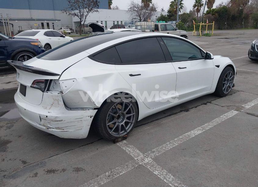 Photo 4 of 2021 Tesla Model 3 STANDARD RANGE PLUS REAR-WHEEL DRIVE (VIN 5YJ3E1EA9MF051204)