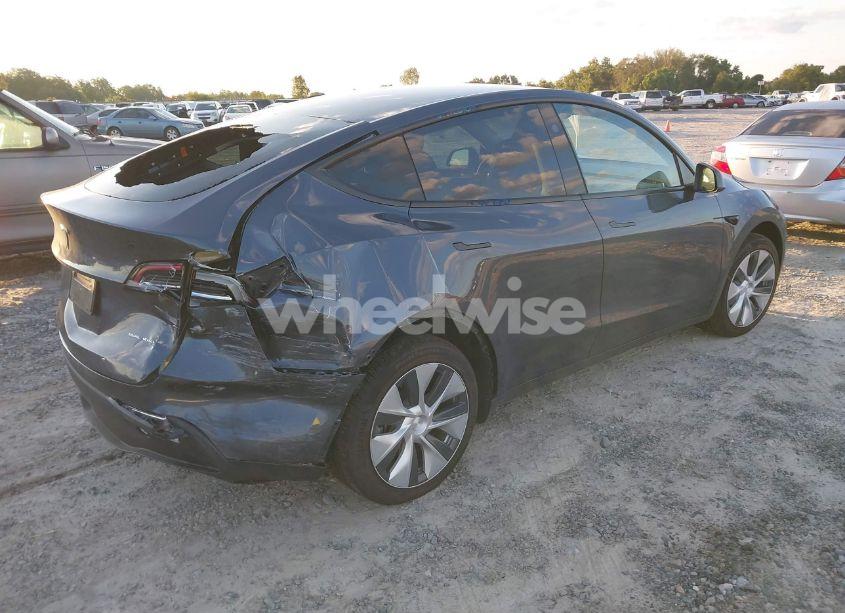 Photo 4 of 2023 Tesla Model Y AWD/LONG RANGE DUAL MOTOR ALL-WHEEL DRIVE (VIN 7SAYGAEE4PF878635)
