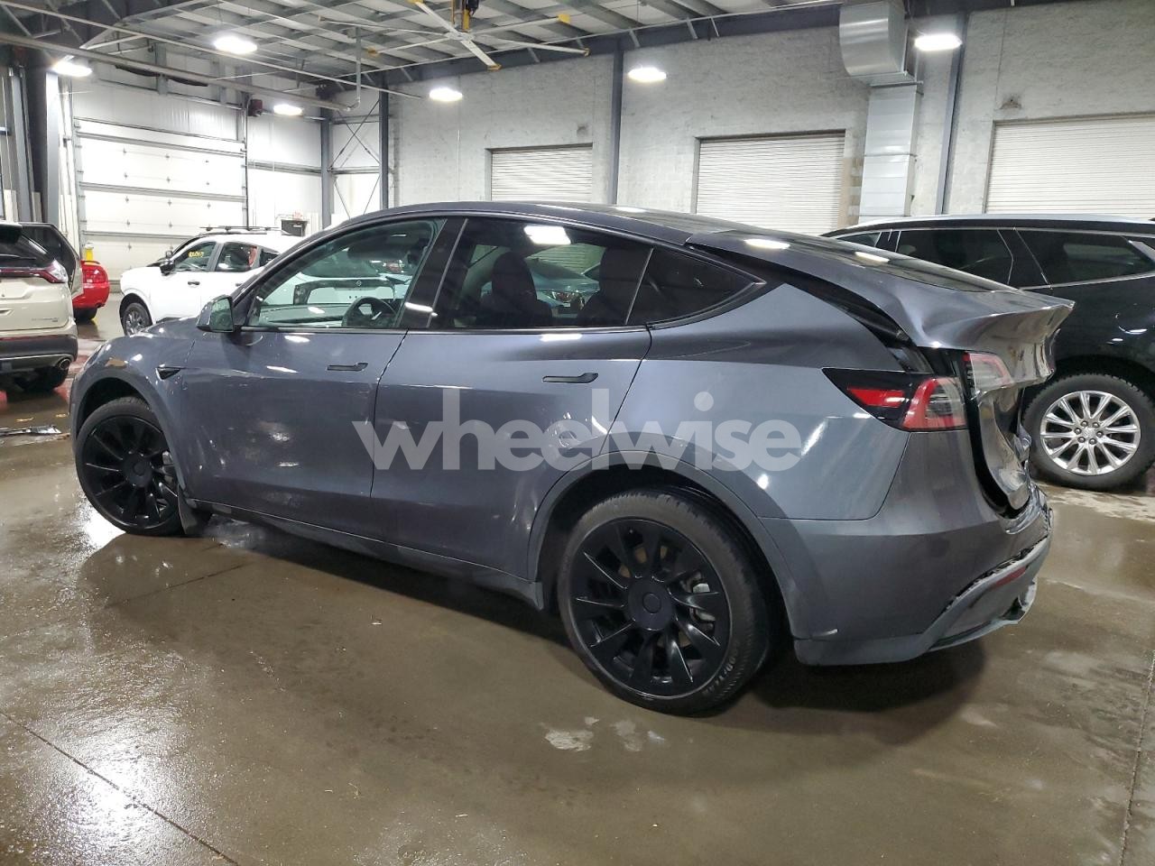 Photo 2 of 2023 TESLA MODEL Y (VIN 7SAYGDEE2PF840709)