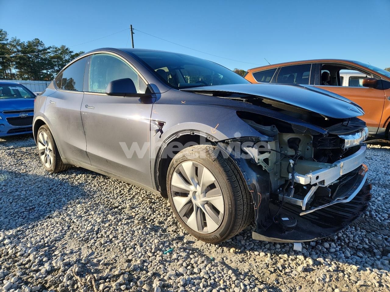 Photo 4 of 2023 TESLA MODEL Y (VIN 7SAYGDEE6PF669849)