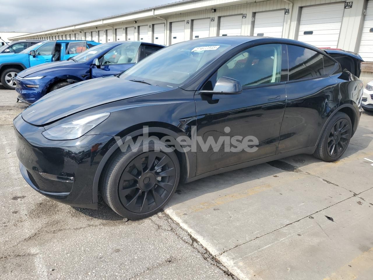 2023 TESLA MODEL Y (VIN 7SAYGDEE9PF777690) main photo
