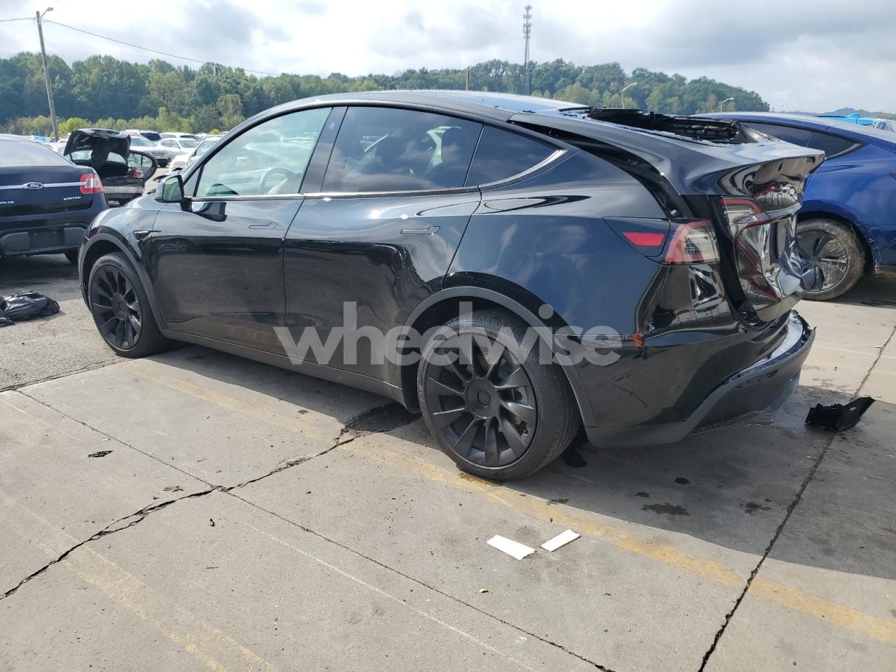 Photo 2 of 2023 TESLA MODEL Y (VIN 7SAYGDEE9PF777690)