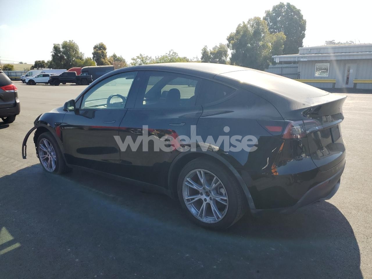 Photo 2 of 2023 TESLA MODEL Y (VIN 7SAYGDEEXPA122774)