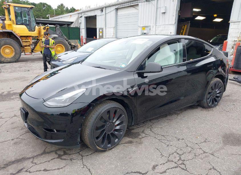Photo 2 of 2023 Tesla Model Y (VIN 7SAYGDEF8PF967702)