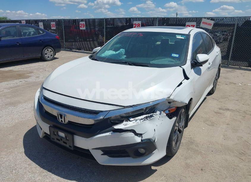 Photo 2 of 2018 Honda Civic EX-T (VIN JHMFC1F3XJX001723)