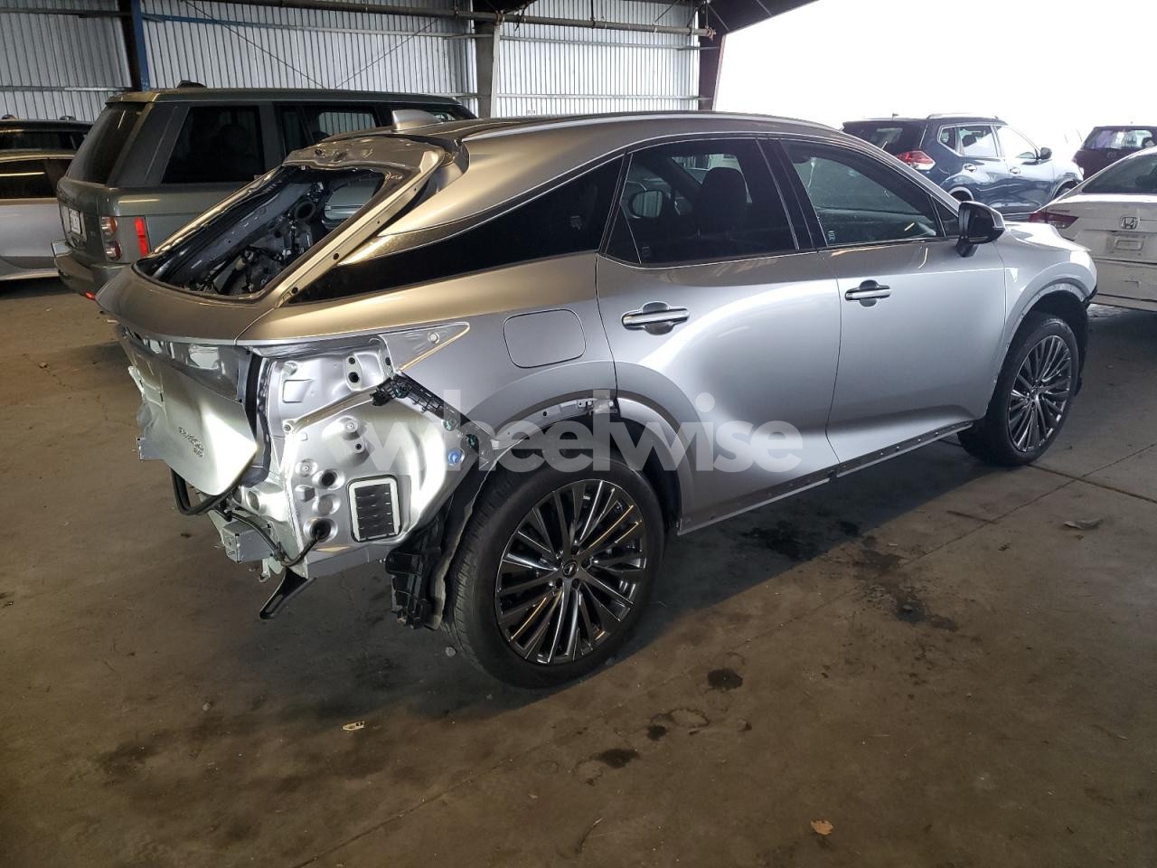 Photo 3 of 2024 LEXUS RX 450H+ LUXURY (VIN JTJCJMGA9R2020648)