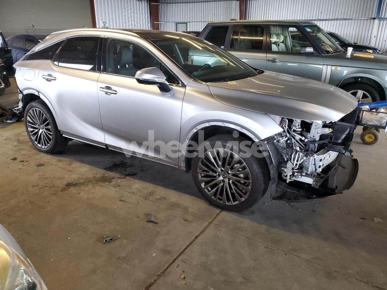 Photo 4 of 2024 LEXUS RX 450H+ LUXURY (VIN JTJCJMGA9R2020648)