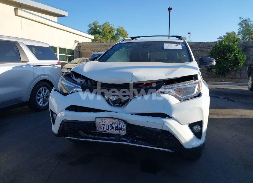 Photo 6 of 2018 Toyota Rav4 HYBRID SE (VIN JTMJJREVXJD228530)