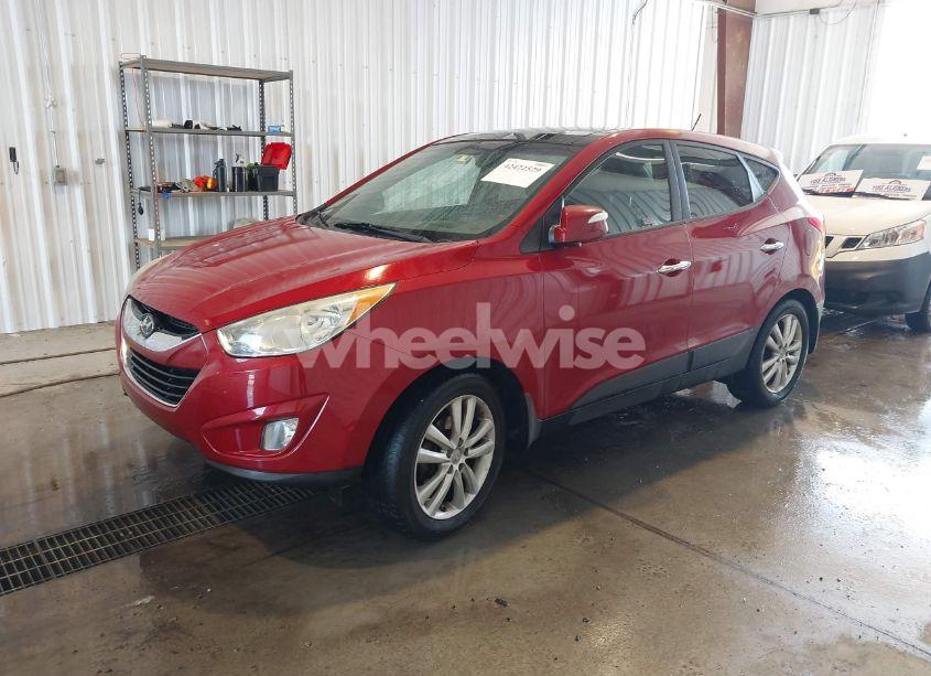 Photo 2 of 2012 Hyundai Tucson LIMITED (VIN KM8JUCAC7CU542739)